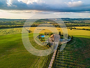 Beautiful landscape scenery of Tuscany in Italy - cypress trees along white road - aerial view -  close to Pienza, Tuscany, Italy