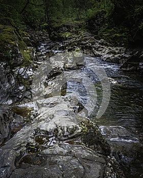 Beautiful landscape of Scotland ,UK.Stream with rocks in woodland