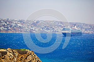 Beautiful landscape with sea view. Cruise liner at the sea near the islands. Mykonos island, Greece