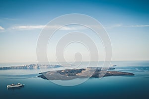 Beautiful landscape with sea view. Cruise liner at the sea near the Nea Kameni, a small Greek island in the Aegean Sea near Santor