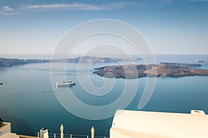 Beautiful landscape with sea view. Cruise liner at the sea near the Nea Kameni, a small Greek island in the Aegean Sea near Santor