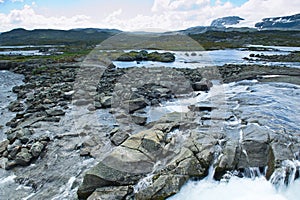 Beautiful landscape seeing from dam of Lake Finsevatnet, snowy mountains and glacier in Finse, Norway