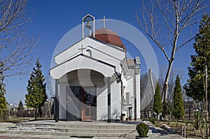 Beautiful landscape with springtime tree and small beauty church, located in Drujba district