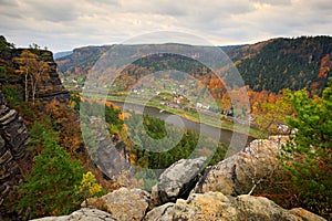 Beautiful landscape, stone above Labe river, forest. Sunset, Czech national park Ceske Svycarsko. Misty evening autumn nature. Lan