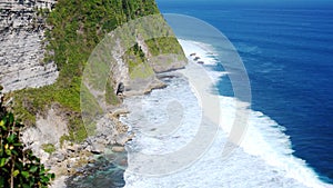 Beautiful landscape of stone cliffs, ocean waves and oceanscape. Aerial top view. Bali, Indonesia.
