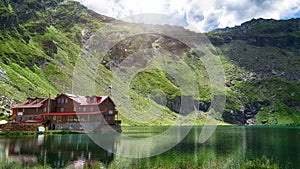 Beautiful landscape sun over mountains with lake between mountains Lacul Balea Transfagarasan