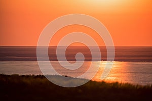 Beautiful landscape with sunset over saline lake Baskunchak