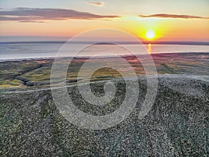 Beautiful landscape with sunset over saline lake Baskunchak