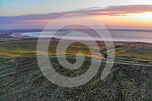 Beautiful landscape with sunset over saline lake Baskunchak