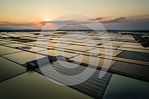 Beautiful landscape at sunset salt Farming. sea-salt production in the country, Sunset in Salt farming at Samut Sakhon Thailand.