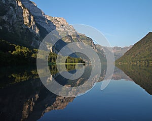 Summer morning at lake Klontalersee, Switzerland. Mountain range