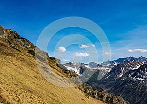 Breathtaking view on Tatra National Park with mountains in sunny spring day with blue sky nearby Zakopane village, Poland