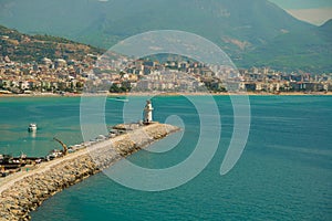 Beautiful landscape top view of the city: the blue sea, lighthouse and port. Alanya, Antalya district, Turkey, Asia