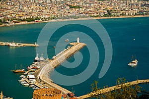 Beautiful landscape top view of the city: the blue sea, lighthouse and port. Alanya, Antalya district, Turkey, Asia