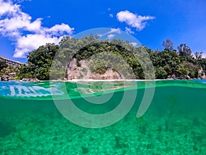 Beautiful landscape on the tropical beach of Boracay island, Philippines. Underwater splitted waterline. The concept of summer