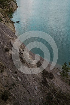 Beautiful landscape - a turquoise bright lake on the site of an old chalk quarry photo