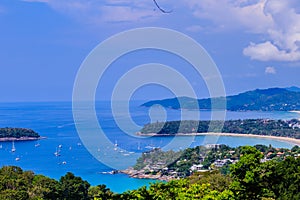 Beautiful landscape of turquoise ocean waves with boats, coastline and blue sky background from high aerial view point