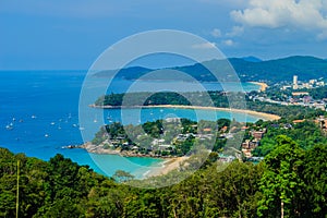 Beautiful landscape of turquoise ocean waves with boats, coastline and blue sky background from high aerial view point