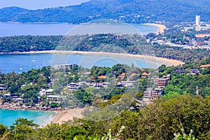 Beautiful landscape of turquoise ocean waves with boats, coastline and blue sky background from high aerial view point