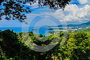 Beautiful landscape of turquoise ocean waves with boats, coastline and blue sky background from high aerial view point