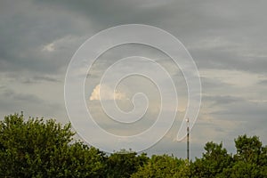 A beautiful landscape with a TV tower and a radio tower and an antenna for mobile communication. In autumn