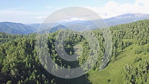 Beautiful landscape of valley in mountains picturesque view in sunny day. Clip. Top view of the mountain forests on a