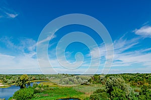 A beautiful landscape: a view of a green valley and a river