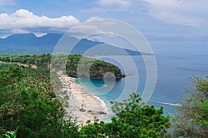 Beautiful landscape with a view of the lost beach in Bali. Virgin beach with white sand and white traditional fishing