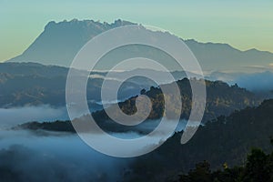 Beautiful landscape view of Sunrise ray nature foggy and Mount Kinabalu