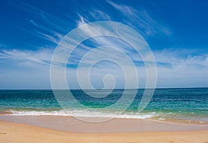 Beautiful Landscape, waves on Atlantic Ocean water against blue sky. Praia de Marinha in Algarve, Portugal