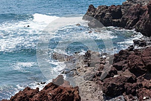 Beautiful landscape where the sea and the volcanic stone coast of Lanzarote