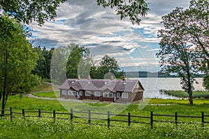 Beautiful landscape of wooden house near lake