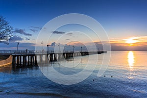 Beautiful landscape with wooden pier in Gdynia Orlowo at sunrise, Poland