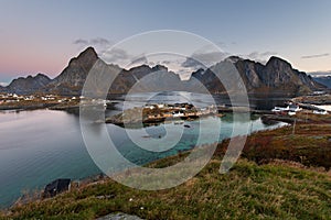 Beautiful landscape from yellow rorbu houses of Sakrisoy fishing village in autumn season, Lofoten islands, Norway