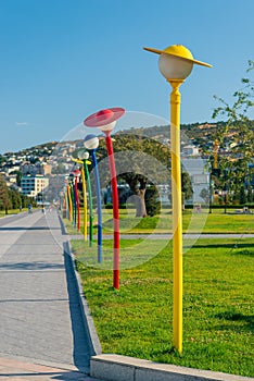 Beautiful lane at Caspian Sea boulevard with colorful funny humanlike lanterns, Baku