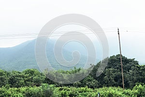 Beautiful lanscape view of green mountain forest of Parasnath hills Jharkhand in India with mist rain clouds