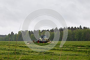 Beautiful lansdscape with haymaking photo