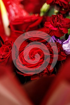 Beautiful large bouquet composed of red and purple flowers closeup