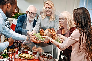 beautiful large family holding christmas turkey