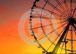 Beautiful large Ferris wheel outdoors at sunset