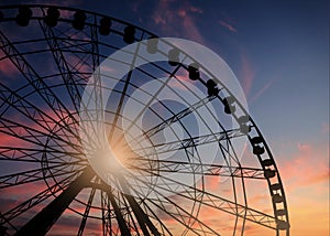 Beautiful large Ferris wheel at sunset, low angle view