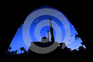 Beautiful large Islamic mosque at the sunset sky background