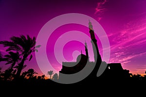 Beautiful large Islamic mosque at the sunset sky background