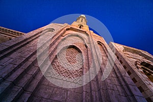 Beautiful large Islamic mosque at the sunset sky background