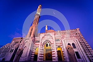 Beautiful large Islamic mosque at the sunset sky background