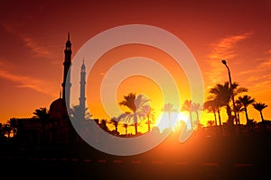 Beautiful large Islamic mosque at the sunset sky background