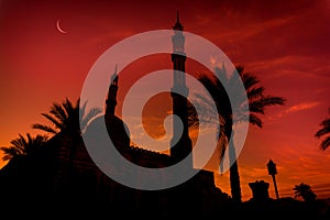 Beautiful large Islamic mosque at the sunset sky background