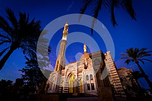 Beautiful large Islamic mosque at the sunset sky background