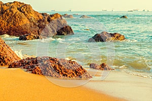 beautiful large stones lying on the ocean shore.