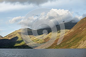 Beautiful late Summer landscape image of Wasdale Valley in Lake District, looking towards Scafell Pike, Great Gable and Kirk Fell